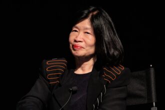 Vivien Li sitting in a chair