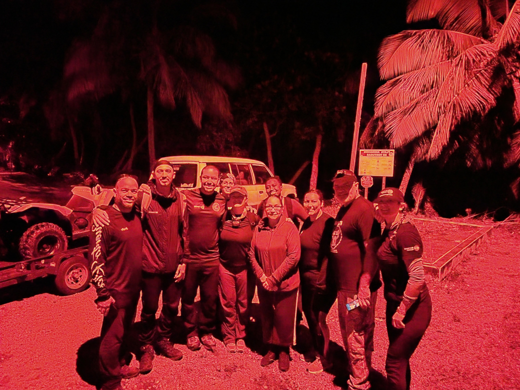 The research team on the beach at night.