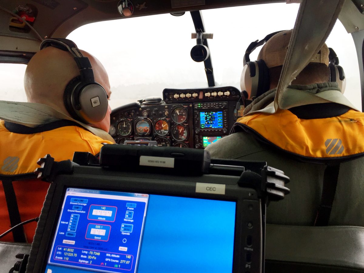 Two people sitting in a cockpit