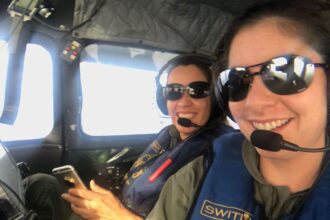 Two women in an airplane cockpit