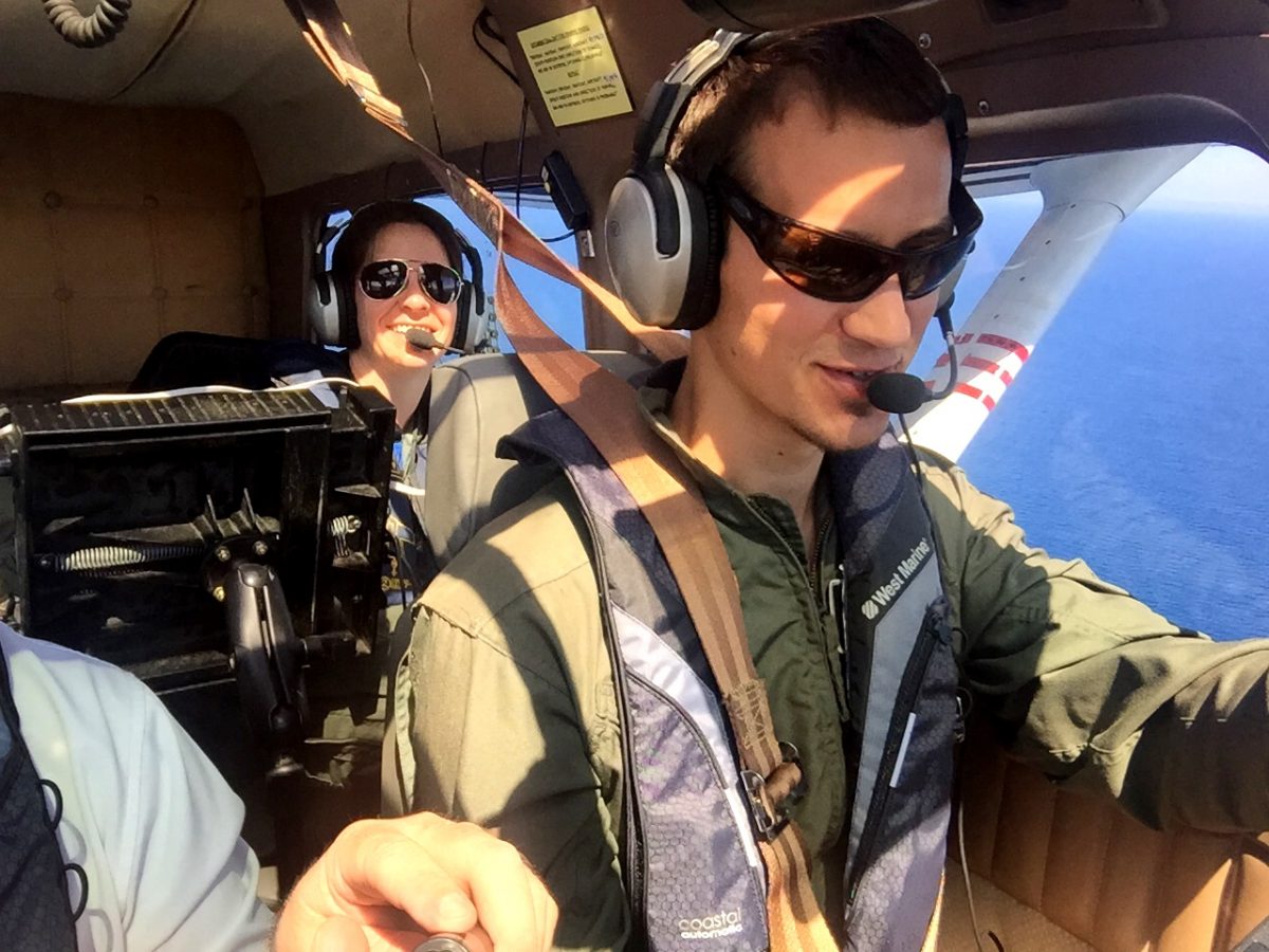 Two people inside an airplane cockpit