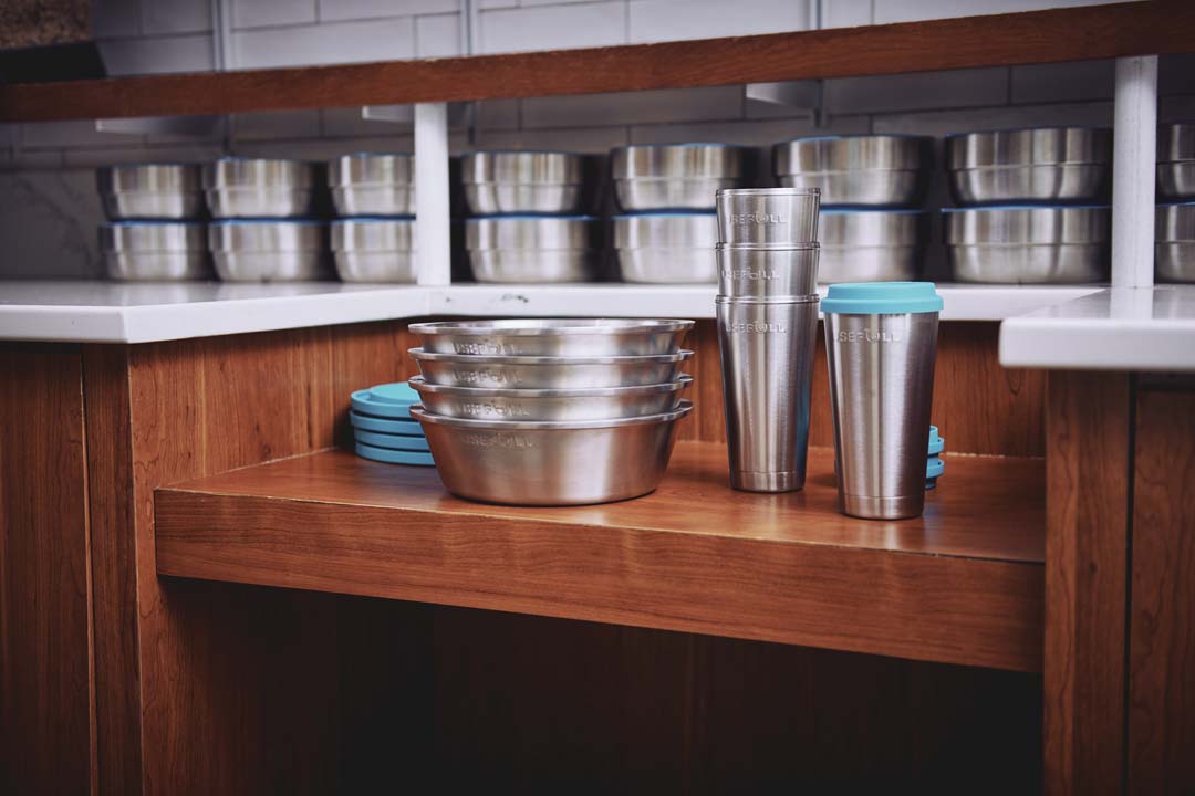 A stack of re-usable metal cups and bowls