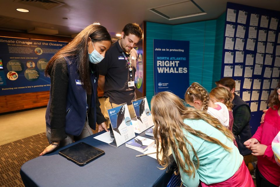 young aquarium visitors at information table