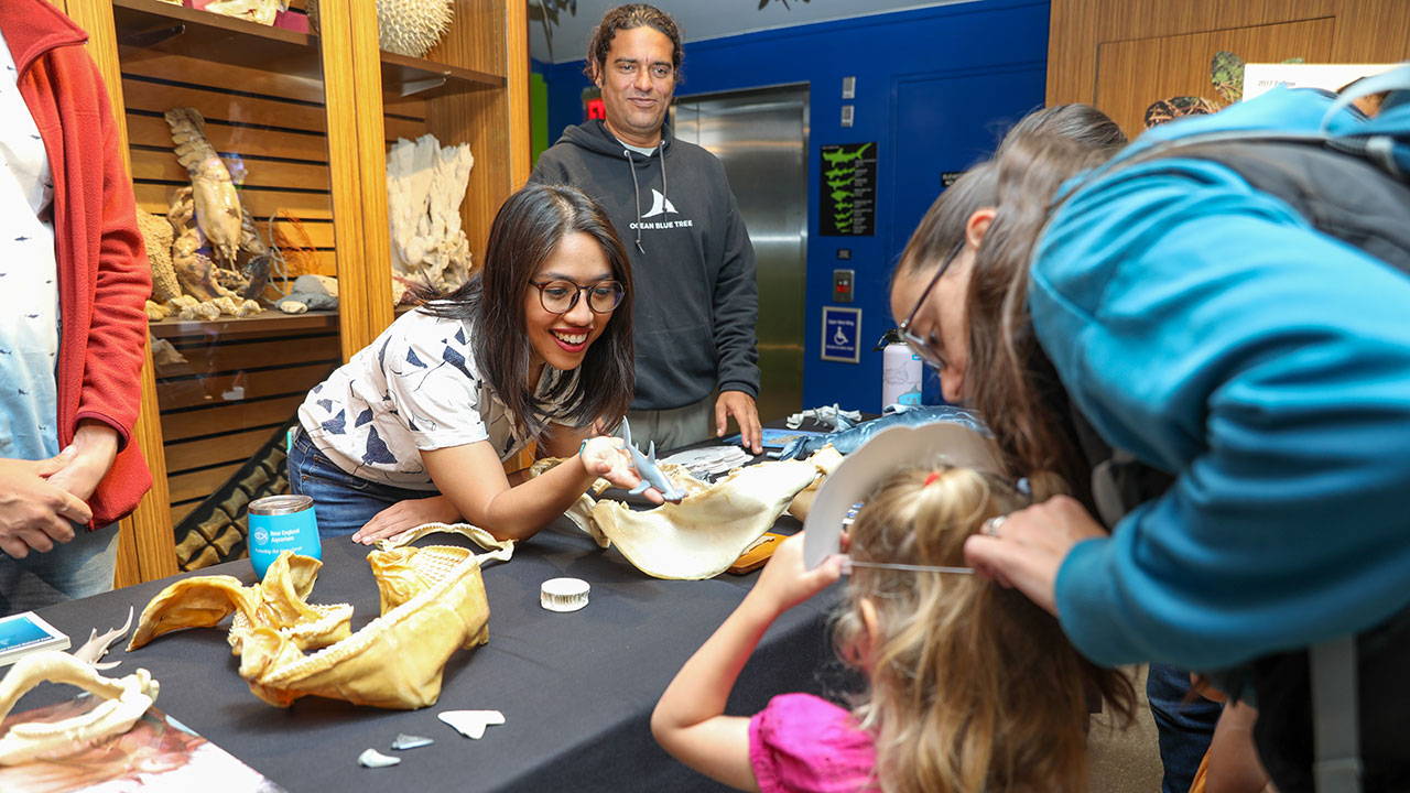 MCAF Fellow Anna Oposa with a young visitor.