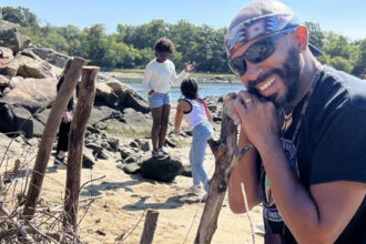 Thomas Green during construction of a fish weir with the community