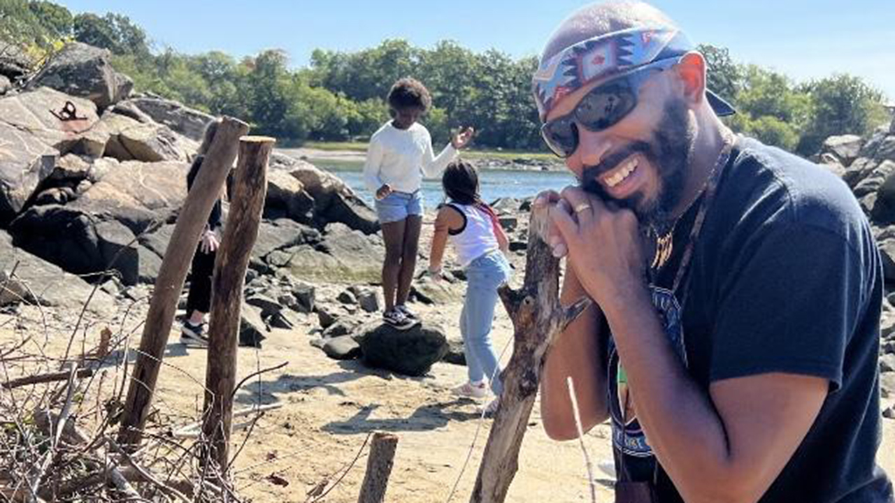 Thomas Green during construction of a fish weir with the community