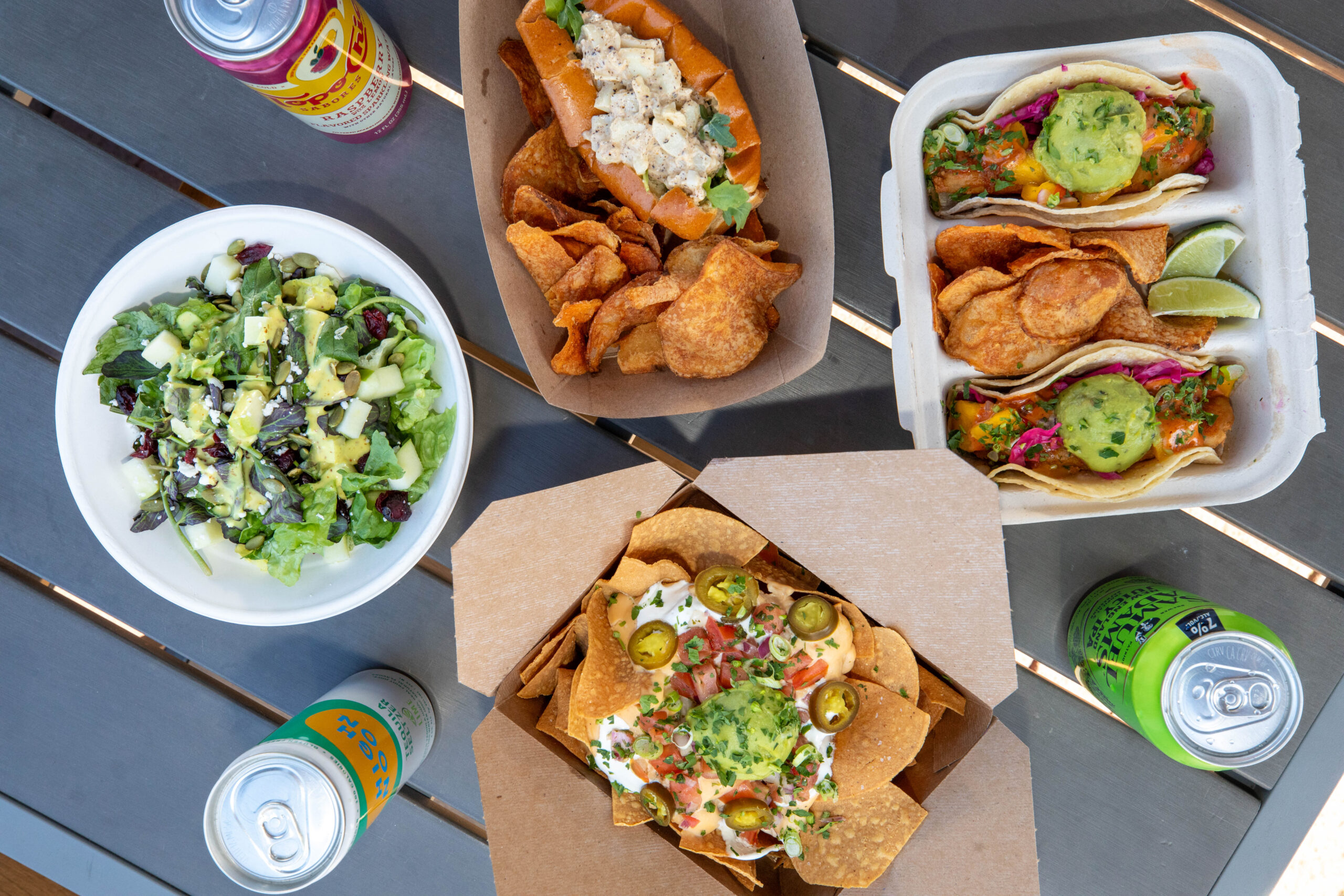 Overhead shot of a table with an assortment of food offered by our beer garden.