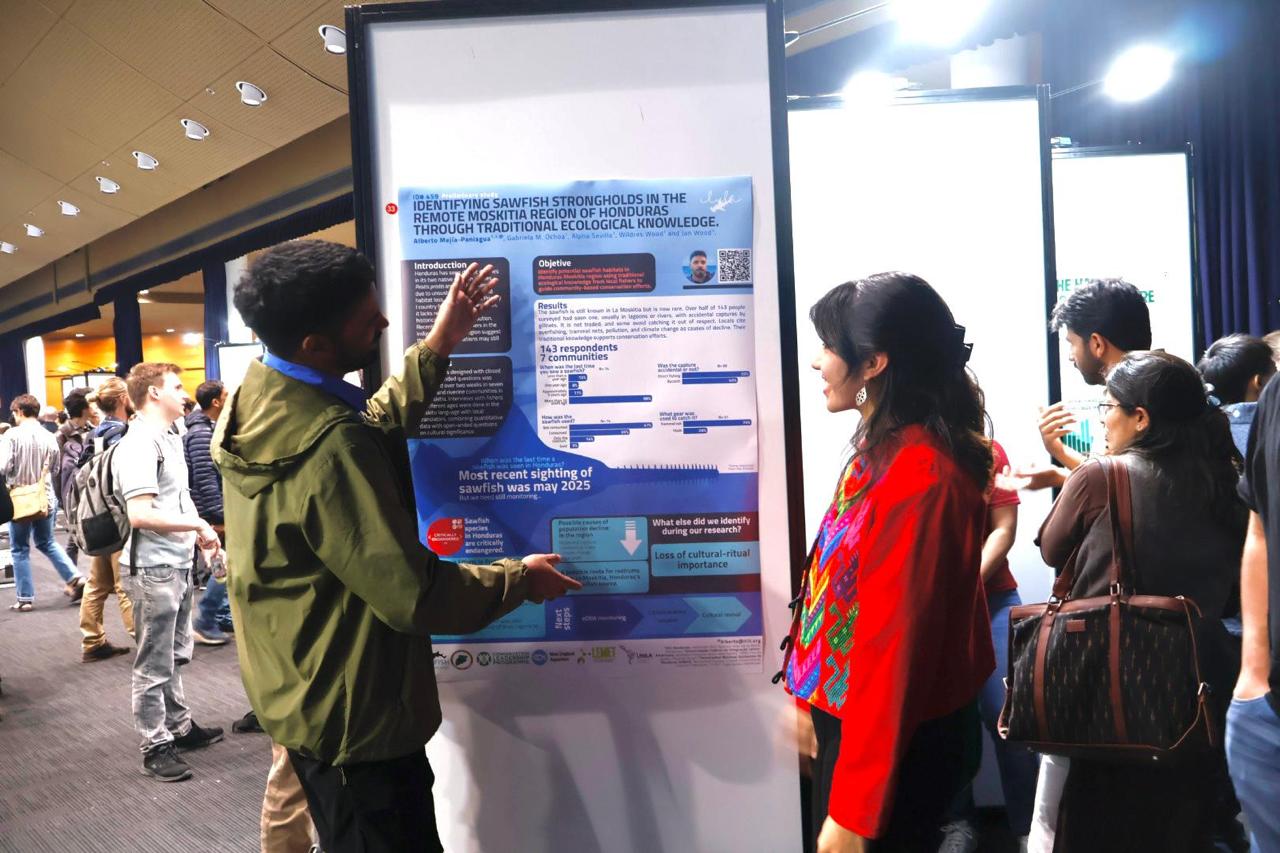 Alberto presenting his poster