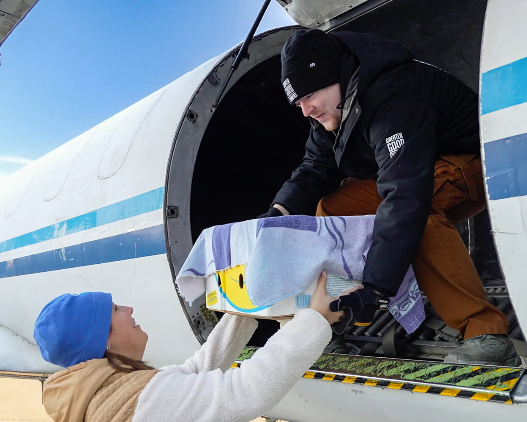 A rescued sea turtle loaded onto a plane