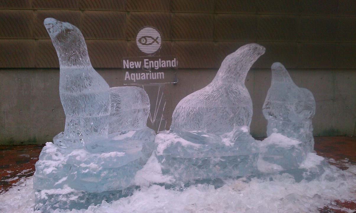 An ice sculpture showing three fur seals