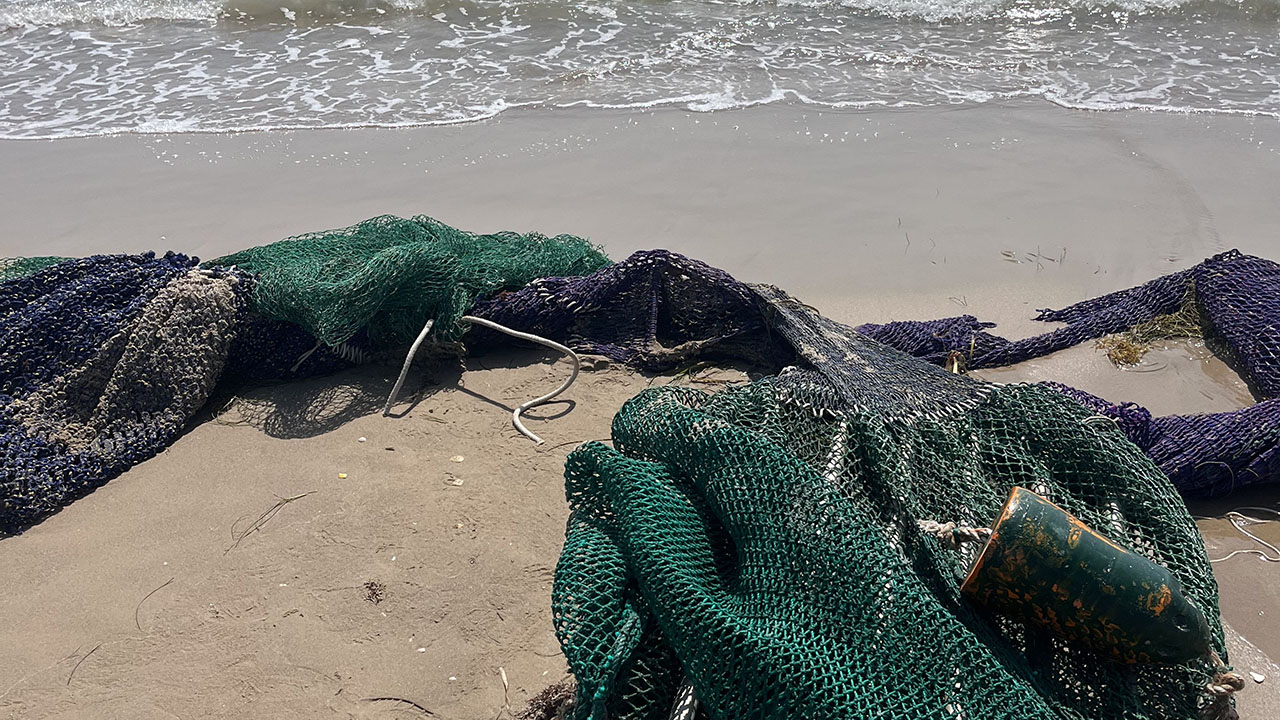 Discarded fishing nets on the beach